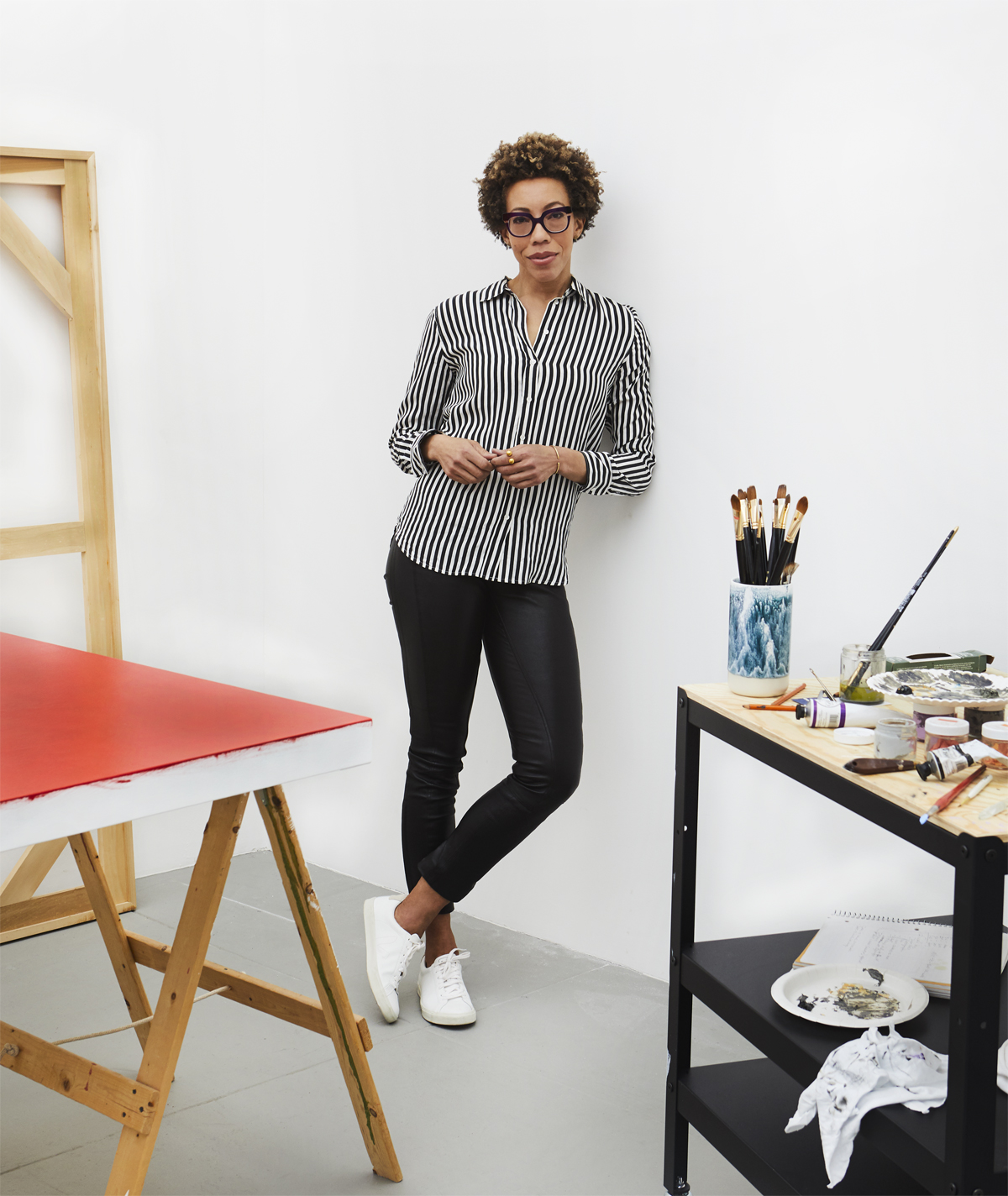 portrait of Amy Sherald in her studio