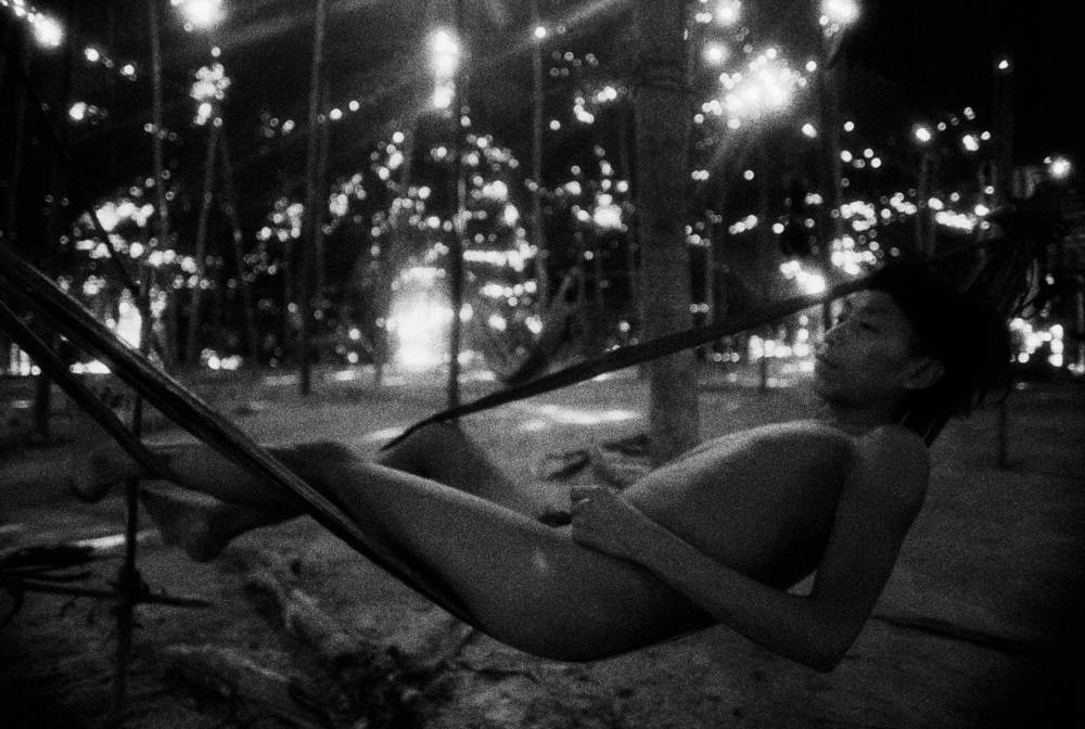 Claudia Andujar, Youth in a barkcloth hammock, Catrimani, Roraima, 1974