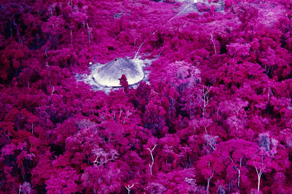 Claudia Andujar, Collective house near the Catholic mission on the Catrimani River, Roraima, infrared film, 1976
