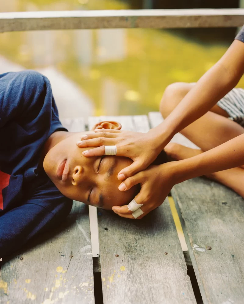 Byron Mohammad Hamzah, Jaidi Playing, from the series Bunga dan Tembok (The Flower and The Wall: The Stateless Youths of Semporna), April 2025